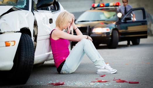 Teen involved in accident with police on the background