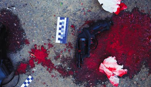 Gun and blood at crime scene