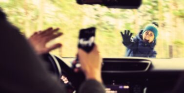 pedestrian accident - man using a phone while driving a car