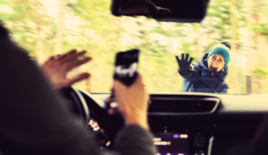 pedestrian accident - man using a phone while driving a car