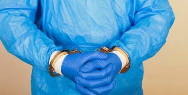 Doctor is handcuffed after a medical malpractice