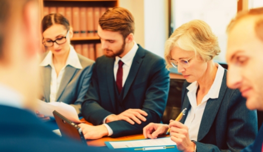Team of Partners in a Law Firm Working Diligently on a Case
