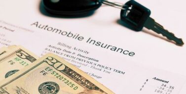 Car key, money and auto insurance policy photo