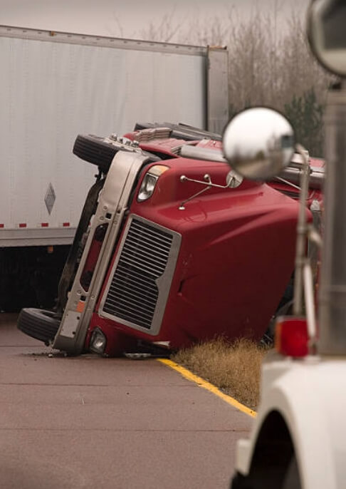 Truck in roll-over accident