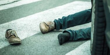 Traffic accident. Young man hit by a car