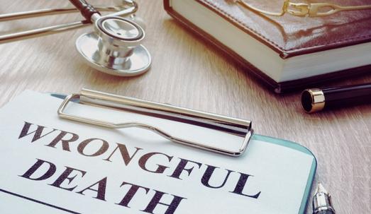 Wrongful death form and stethoscope on a table