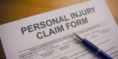 personal injury claim form with a pen on top