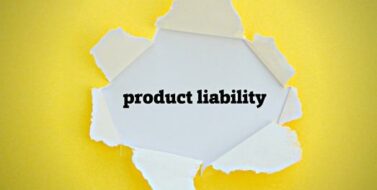 PRODUCT LIABILITY word written under torn paper.