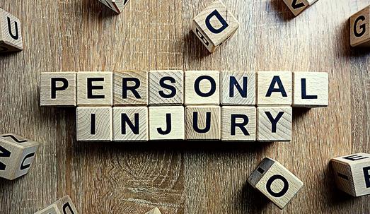 Personal Injury Text from Wooden Blocks on Desk