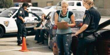 two police officers responding to a traffic accident. Concept of the anatomy of a rideshare accident claim