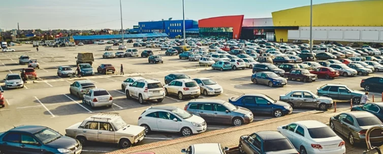 Car parking in the supermarket complex in the evening. parking lot accidents