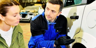 Mechanician with insurance adjuster checking on auto repair. Giving a Recorded Statement to Insurance Adjusters
