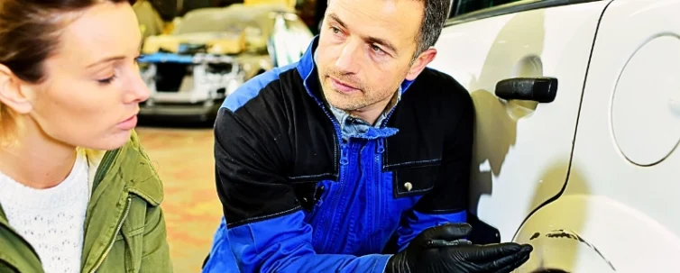 Mechanician with insurance adjuster checking on auto repair. Giving a Recorded Statement to Insurance Adjusters