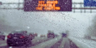 Hazardous weather condition on the road seen through windshield. weather affects car accident liability