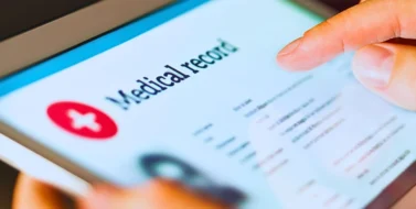Electronic medical record with patient data and health care information in tablet.