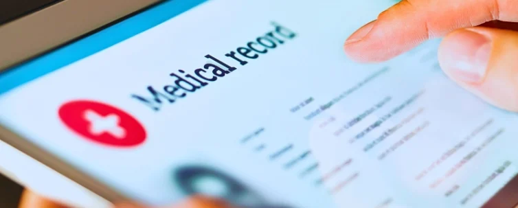 Electronic medical record with patient data and health care information in tablet.