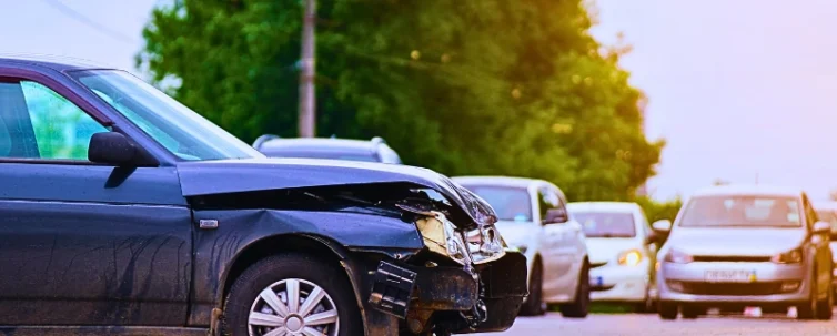 Damaged in car accident vehicle on city street crash site. Why Car Accident Evidence Disappears