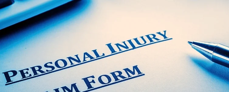 Close-up of personal injury claim form and pen. injury claim when the injury becomes permanent